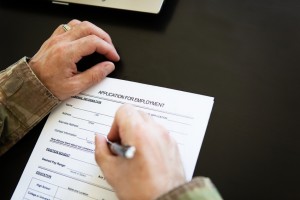 veteran filling out employment application