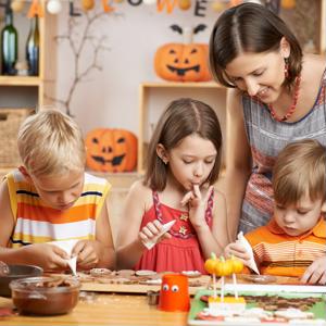 Military family making Halloween treats and crafts