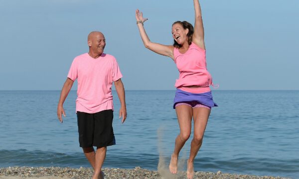 Happy retired couple on the beach